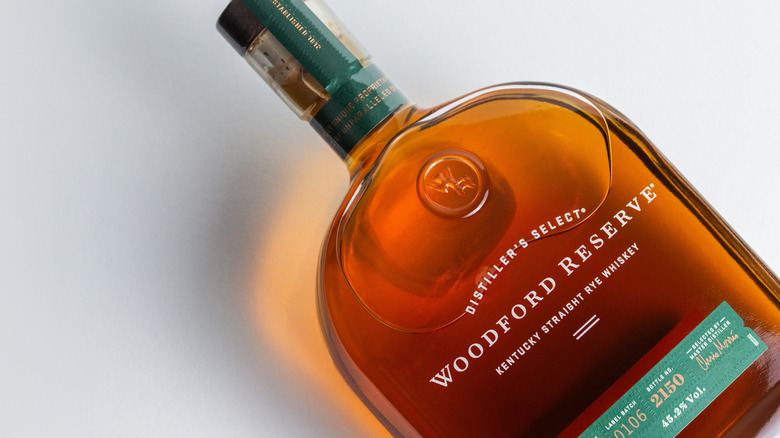 A bottle of Woodford Reserve rye on its back.