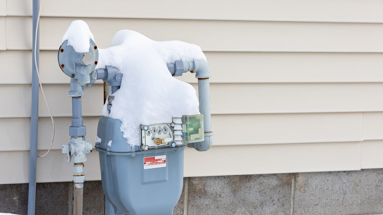 Energy meter outside covered in snow
