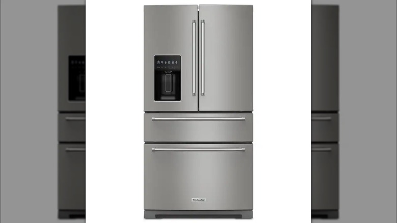 A sleek, stainless fridge with several doors