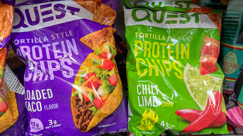 a close up of a bag of Loaded Taco Quest Protein Chips and a bag of Chili Lime Quest Protein Chips