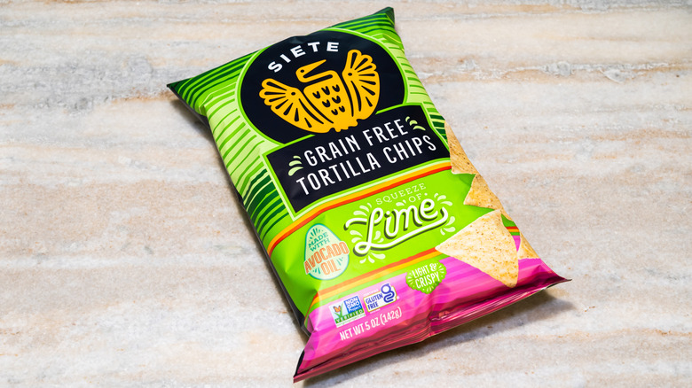 a bag of Siete Lime Grain Free Tortilla Chips on a marble background