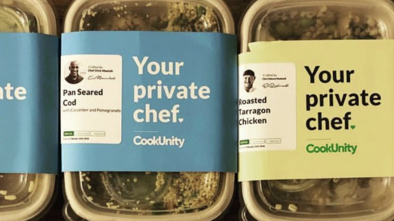 Unopened boxes of Cook Unity food with labels on them