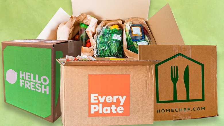 Hello Fresh, Every Plate, and HomeChef boxes with an open box of groceries