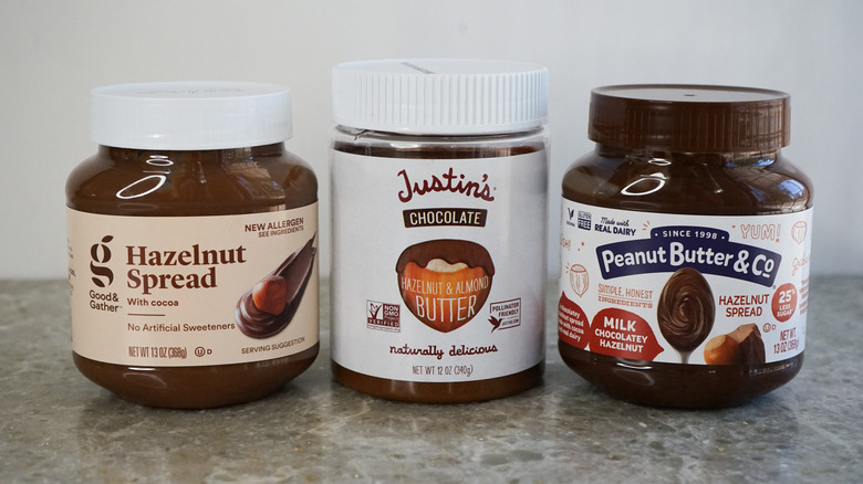 Good & Gather, Justin's, and Peanut Butter & Co. chocolate hazelnut spread on granite counter