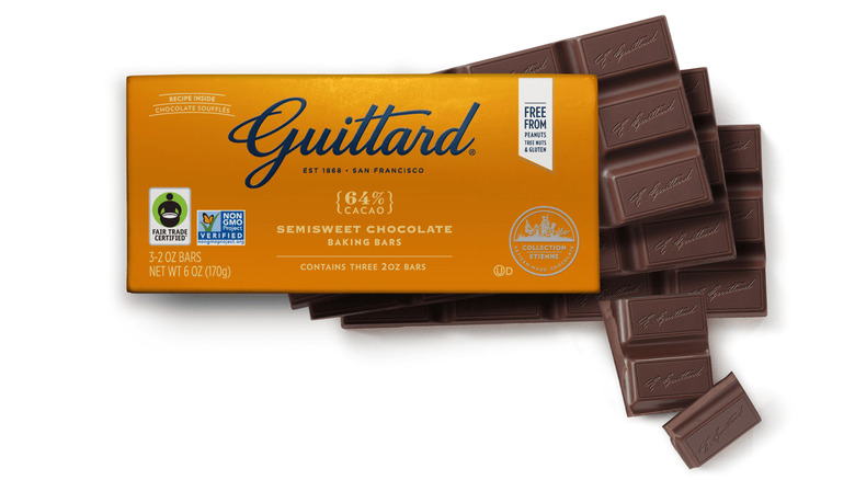a Guittard Semisweet Baking Bar, 64% with its packaging and bar on a white isolated background