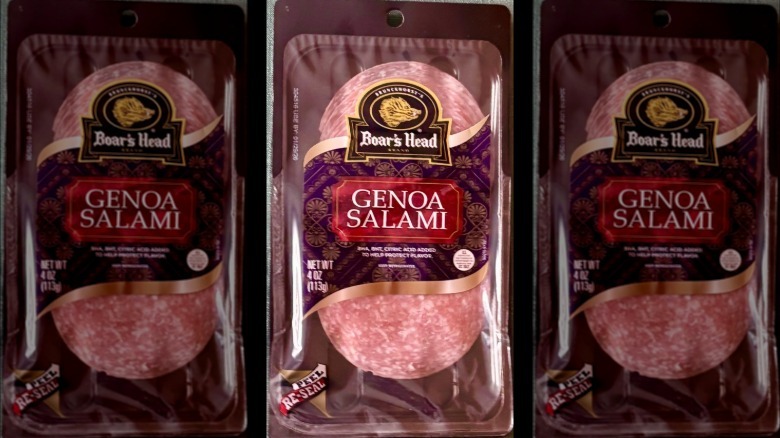 A package of Boar's Head Genoa Salami resting on a green tablecloth