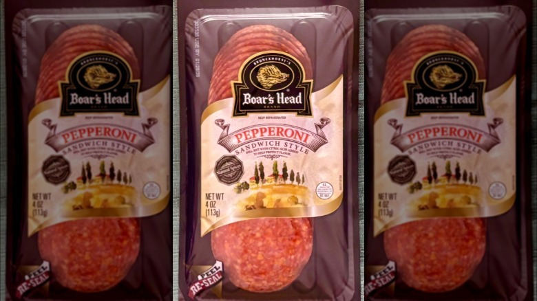 A package of Boar's Head Sandwich Style Pepperoni resting on a green tablecloth