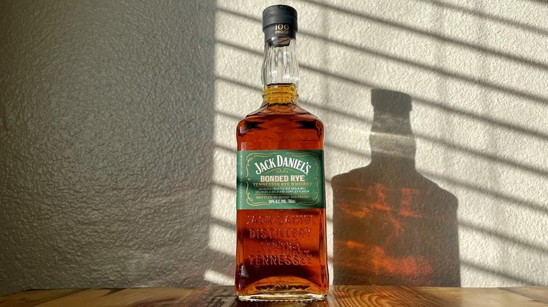 Bottle of Jack Daniel's Bonded Rye on wooden tabletop