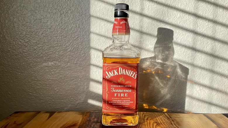 Bottle of Jack Daniel's Tennessee Fire on wooden tabletop