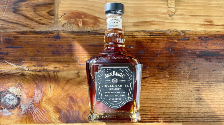 Bottle of Jack Daniel's Single Barrel Select lying down on wooden tabletop