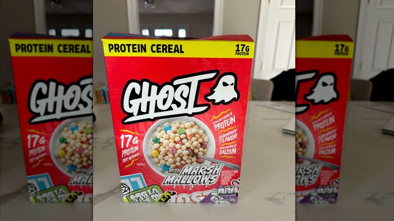 A box of Ghost Protein Cereal on a table in a house