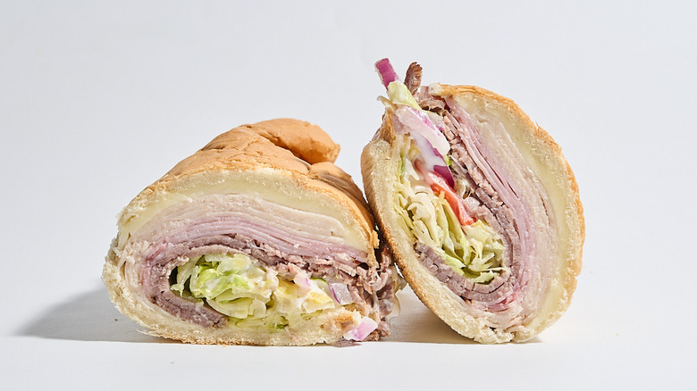 Subway club sub sliced in half on a table.