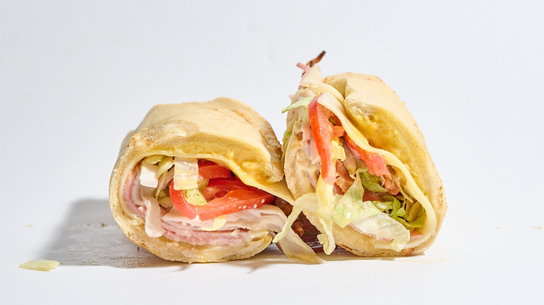 Penn Station Club sandwich sliced in half on a table