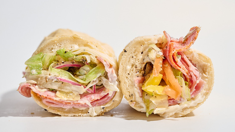 Penn Station Classic Italian sandwich sliced in half on a white table