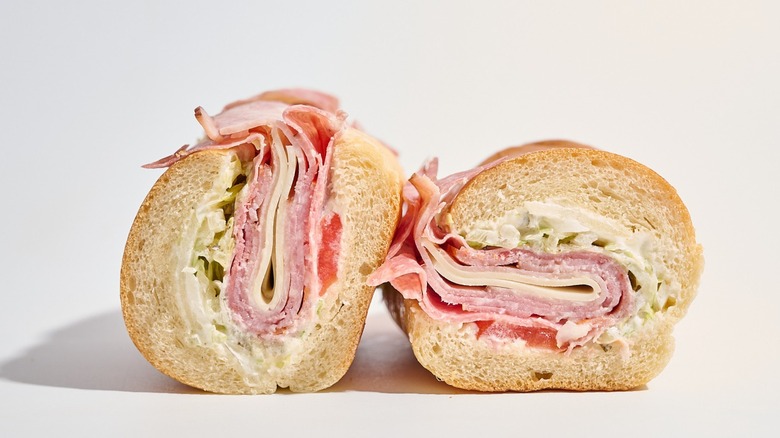 Jimmy John's Italian Night Club sandwich sliced in half on a white table