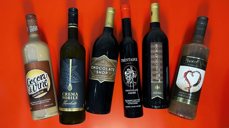 6 bottles of chocolate wine arranged on a red background