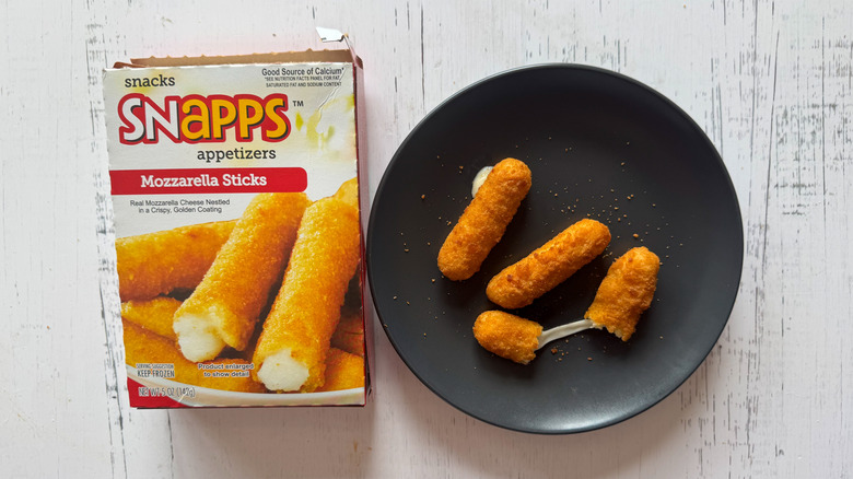 Snapps mozzarella sticks on plate with a box