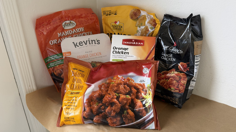 An array of six different frozen orange chicken meals