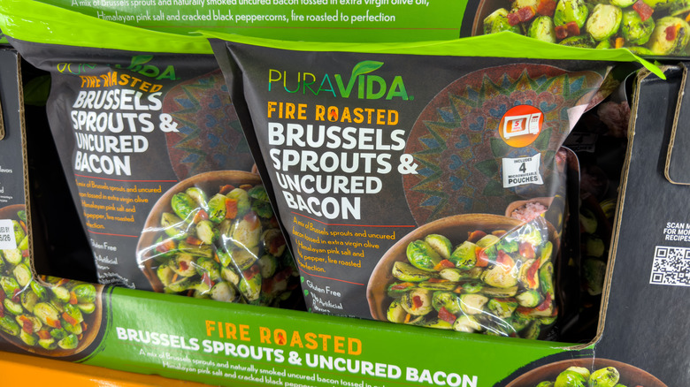 Bags of PuraVida Fire Roasted Brussels Sprouts & Uncured Bacon on display in Costco freezers