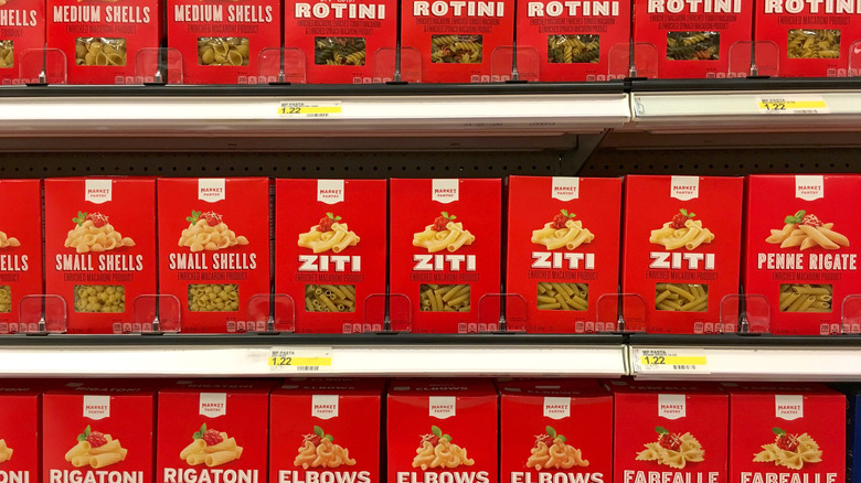 Boxes of various types of Market Pantry pasta on display in Target