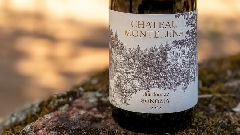 a close-up shot of the Chateau Montelena Chardonnay wine label on a moss covered rock