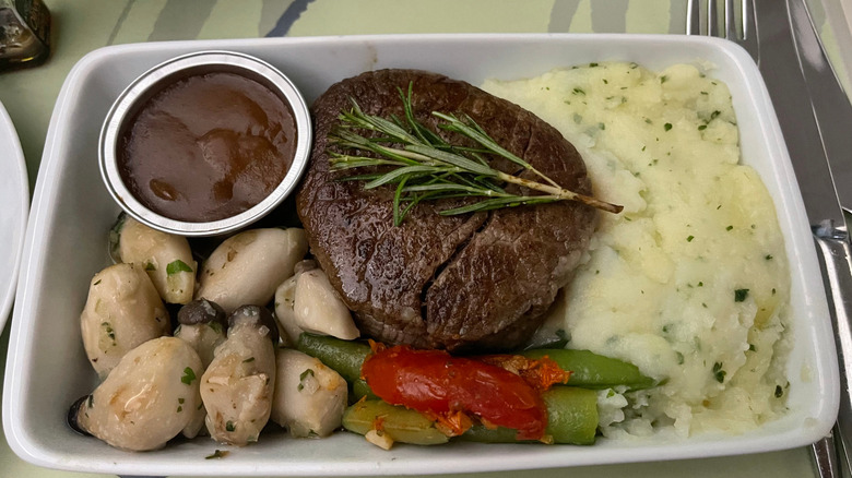 The meat option of an in-flight meal