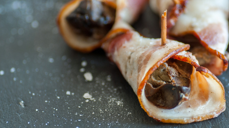 Chicken liver wrapped in bacon with a toothpick