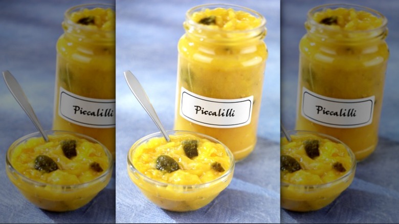 Glass jar and dish full of Piccalilli sauce