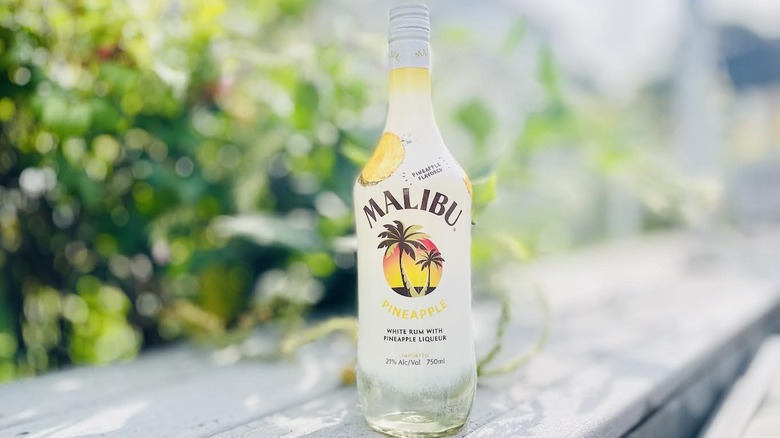 Bottle of Malibu Pineapple Rum on outdoor ledge