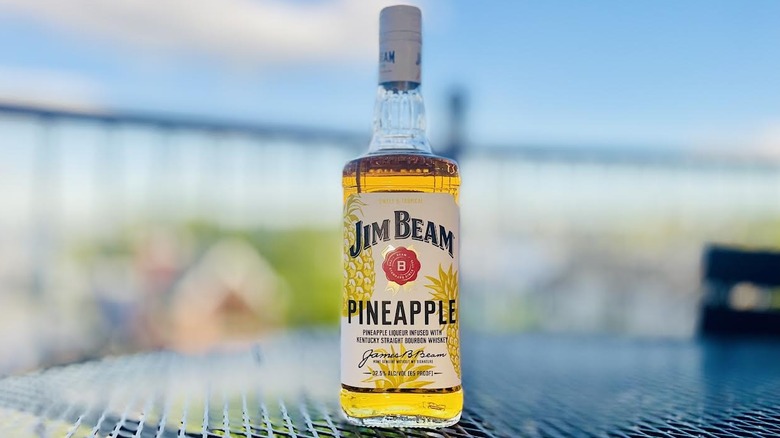 Bottle of Jim Beam Pineapple on outdoor patio table