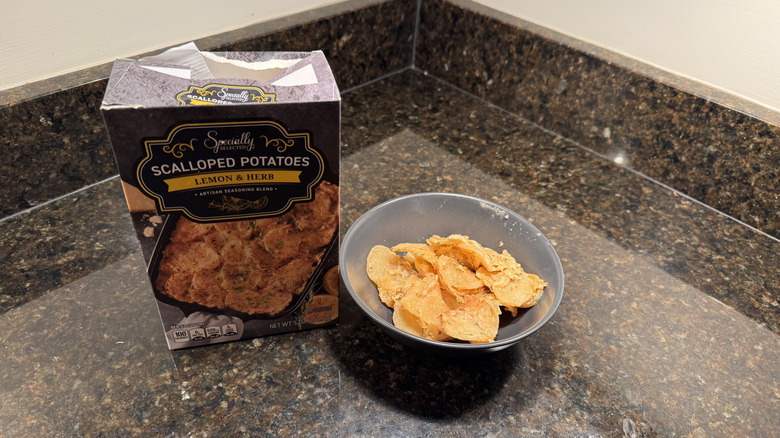 Box of scalloped potatoes with bowl on countertop