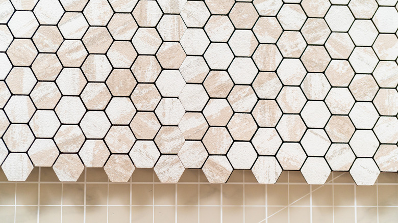 pieces of peel-and-stick tile lined up