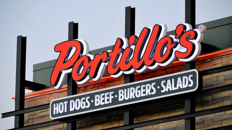 The red sign outside a Portillos restaurant