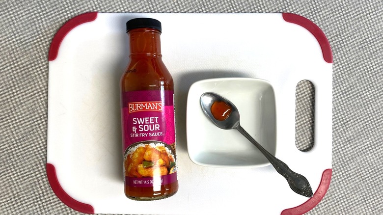 Aldi sweet and sour sauce displayed with a sample in a spoon