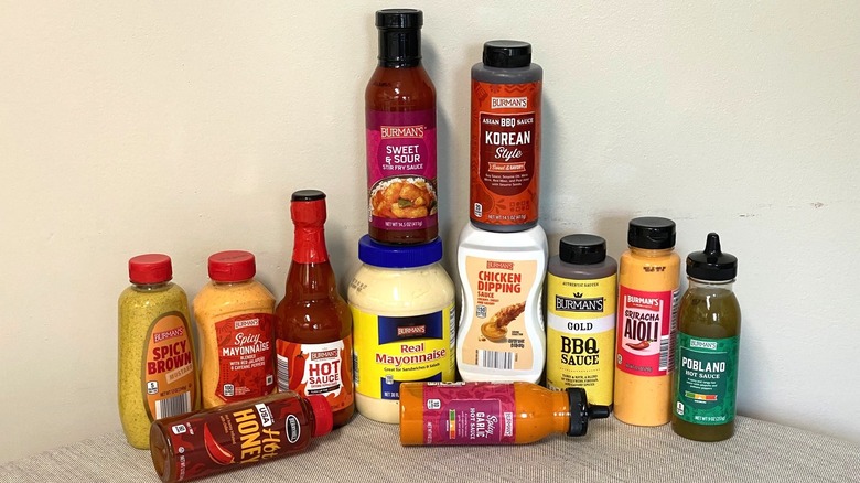 12 Aldi sauces stacked on a table