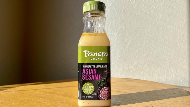 Bottle of Panera Bread Asian Sesame Dressing on wood table