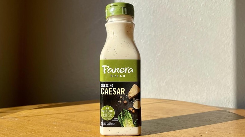 Bottle of Panera Bread Caesar Dressing on wood table