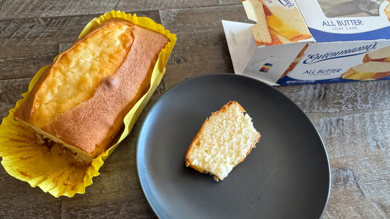 cake loaf besides slice of pound cake on black plate