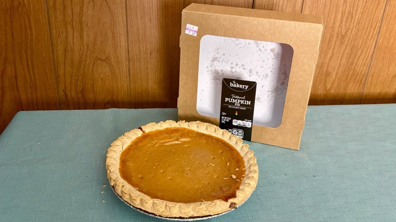 Stop & Shop brand pumpkin pie sits in pie tin in front of empty packaging