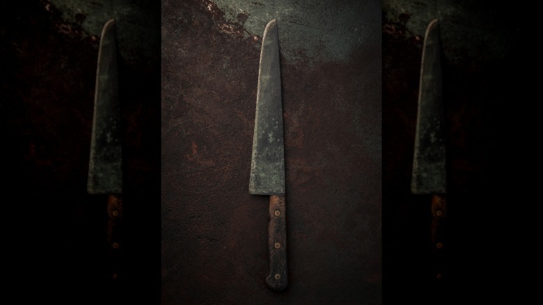A large, vintage chef's knife
