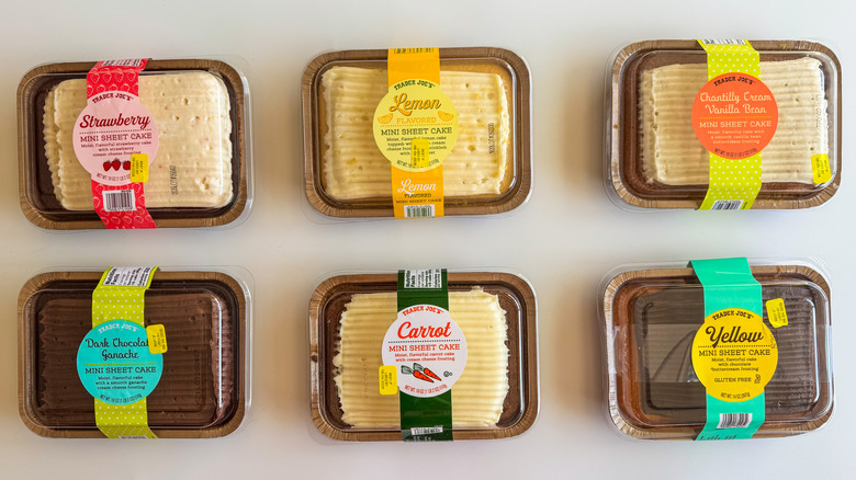 Six mini sheet cakes on a white surface