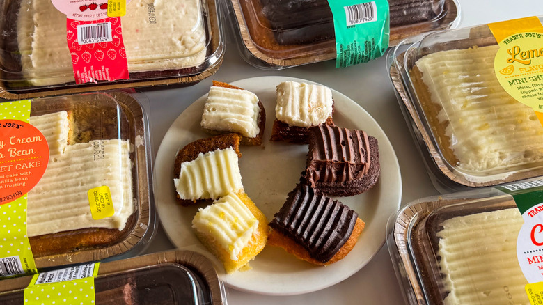 Sheet cakes with plate and cakes on white background