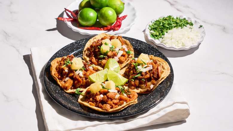 A plate of tacos al pastor.