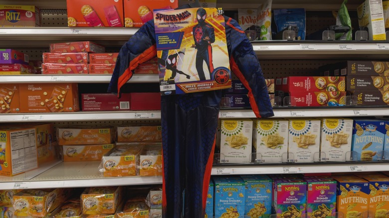 Spiderman costume hanging in the crackers aisle