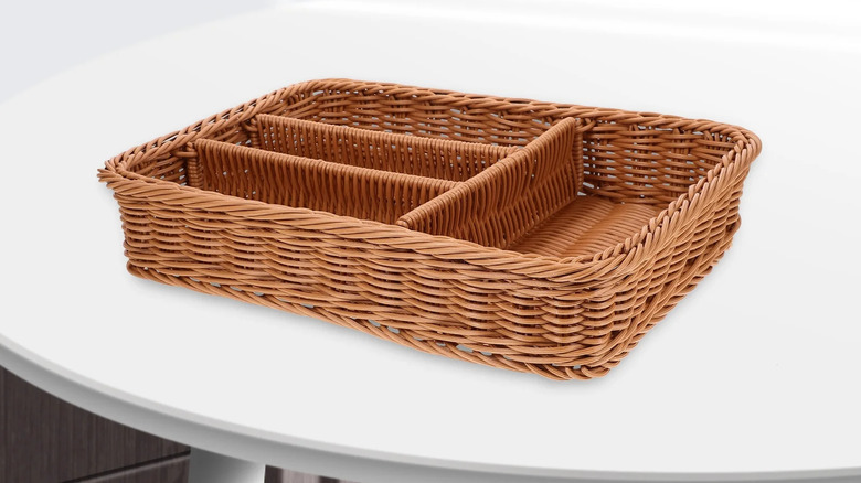 an imitation rattan cutlery organizer on a white table