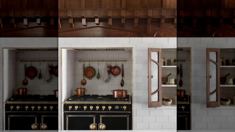 Kitchen with fireplace converted into space for range