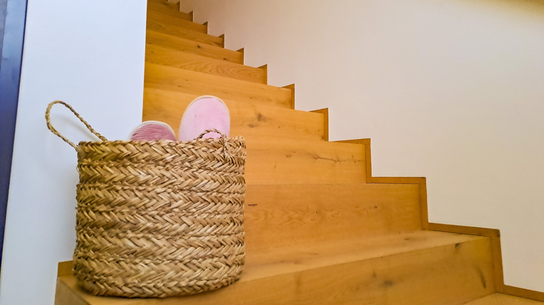 Close up of storage basket on wooden stairs