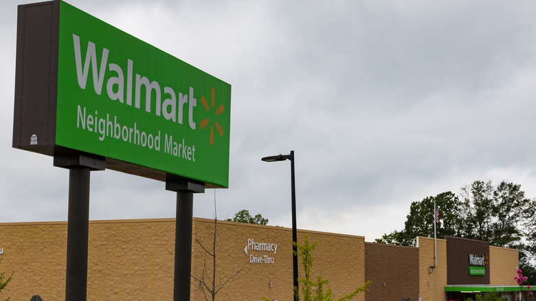 Exterior of Walmart Neighborhood Market with green sign at the front