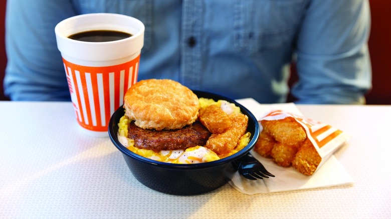 a Whataburger breakfast bowl with a coffee and hashbrown sticks