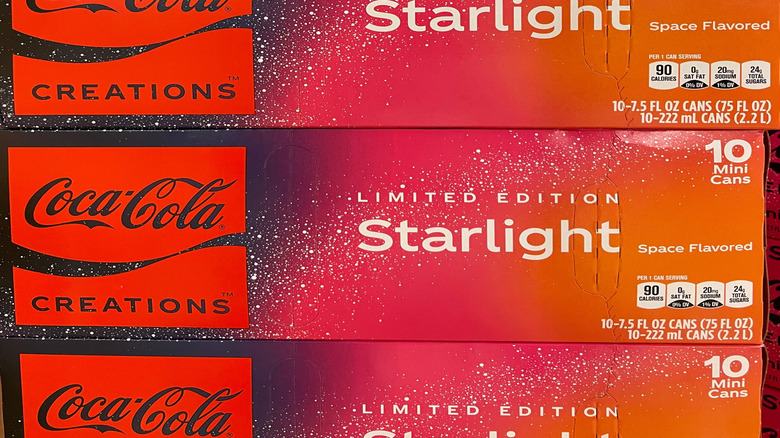 Boxes of Coca-Cola Starlight mini cans in a stack
